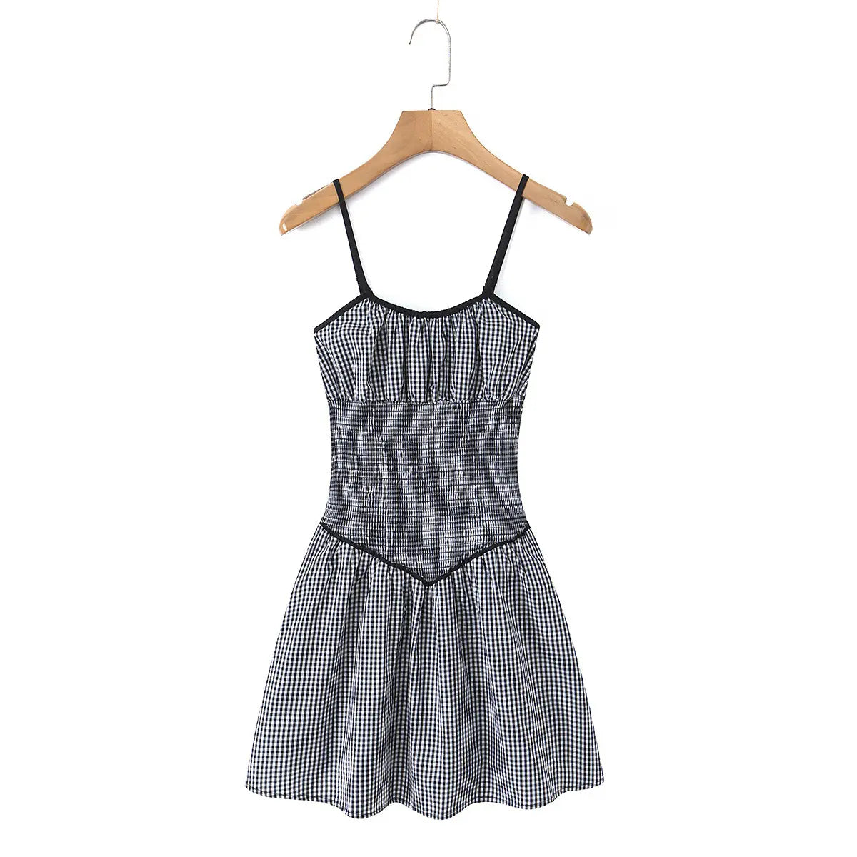 Full front view of the gingham cami dress on a wooden hanger.