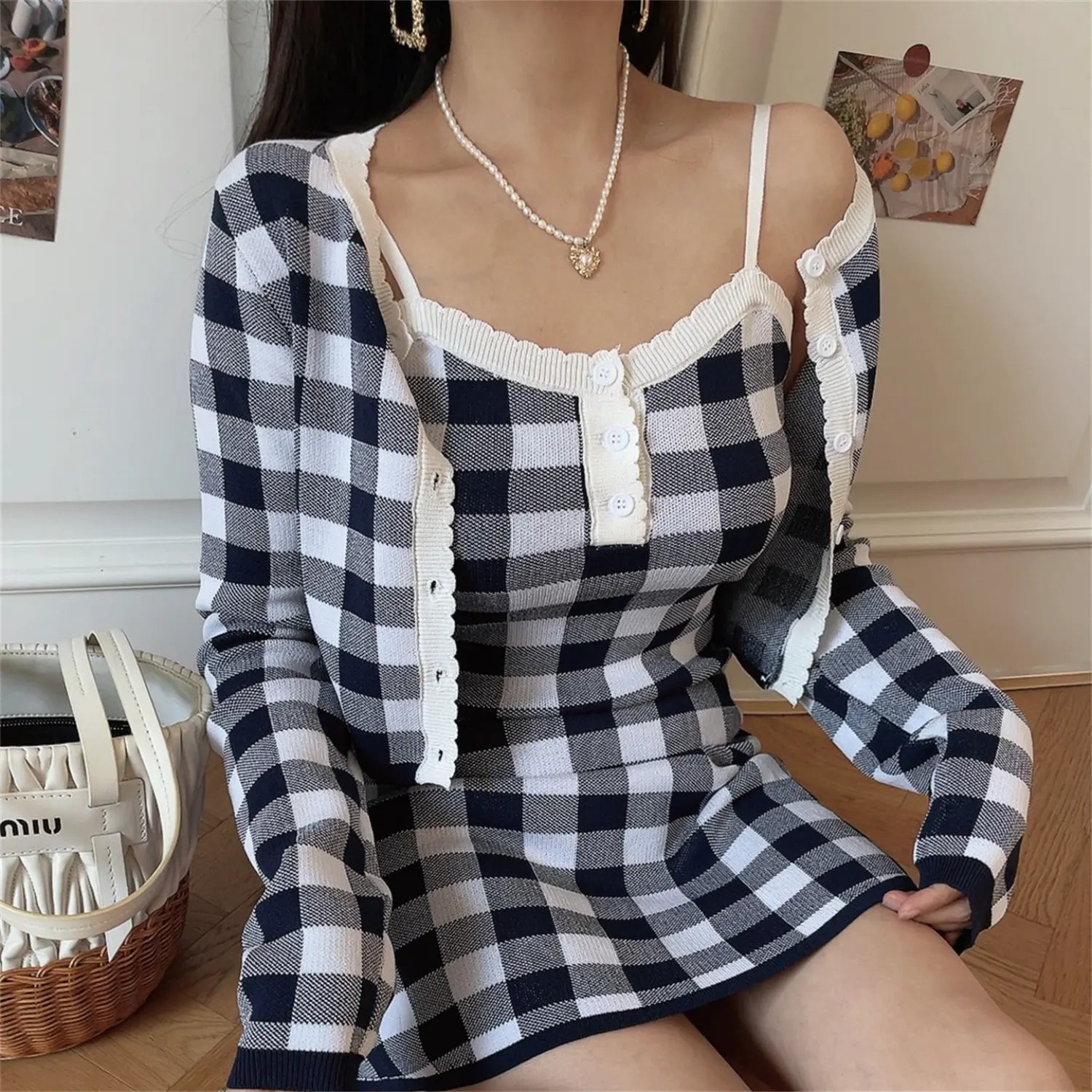 Side sitting view black check knit set, relaxed cropped open cardigan, high stretch slim fit mini cami dress, vacation casual sweet outfit