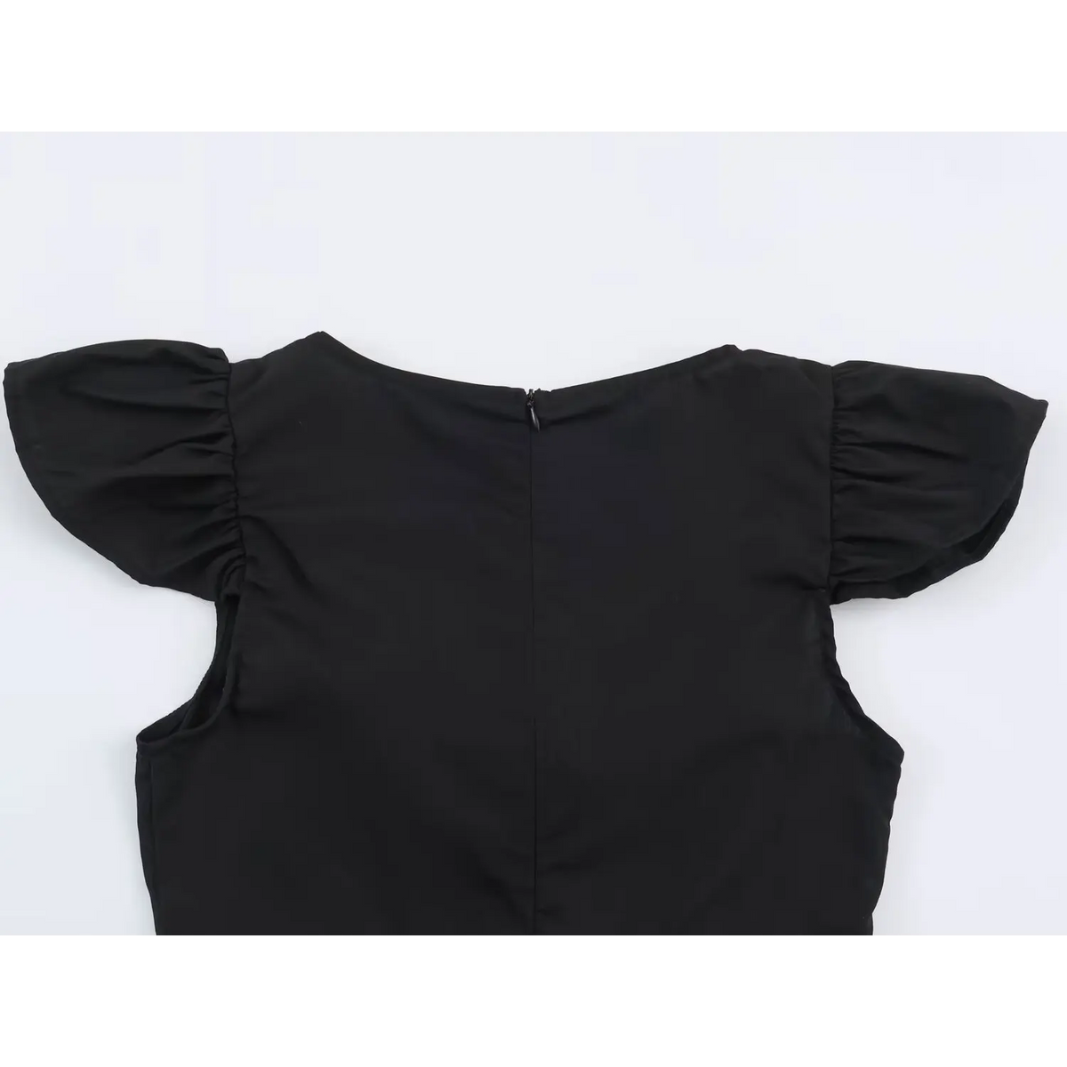 Back view of black top with center zip, ruffle cap sleeves and pleated hem