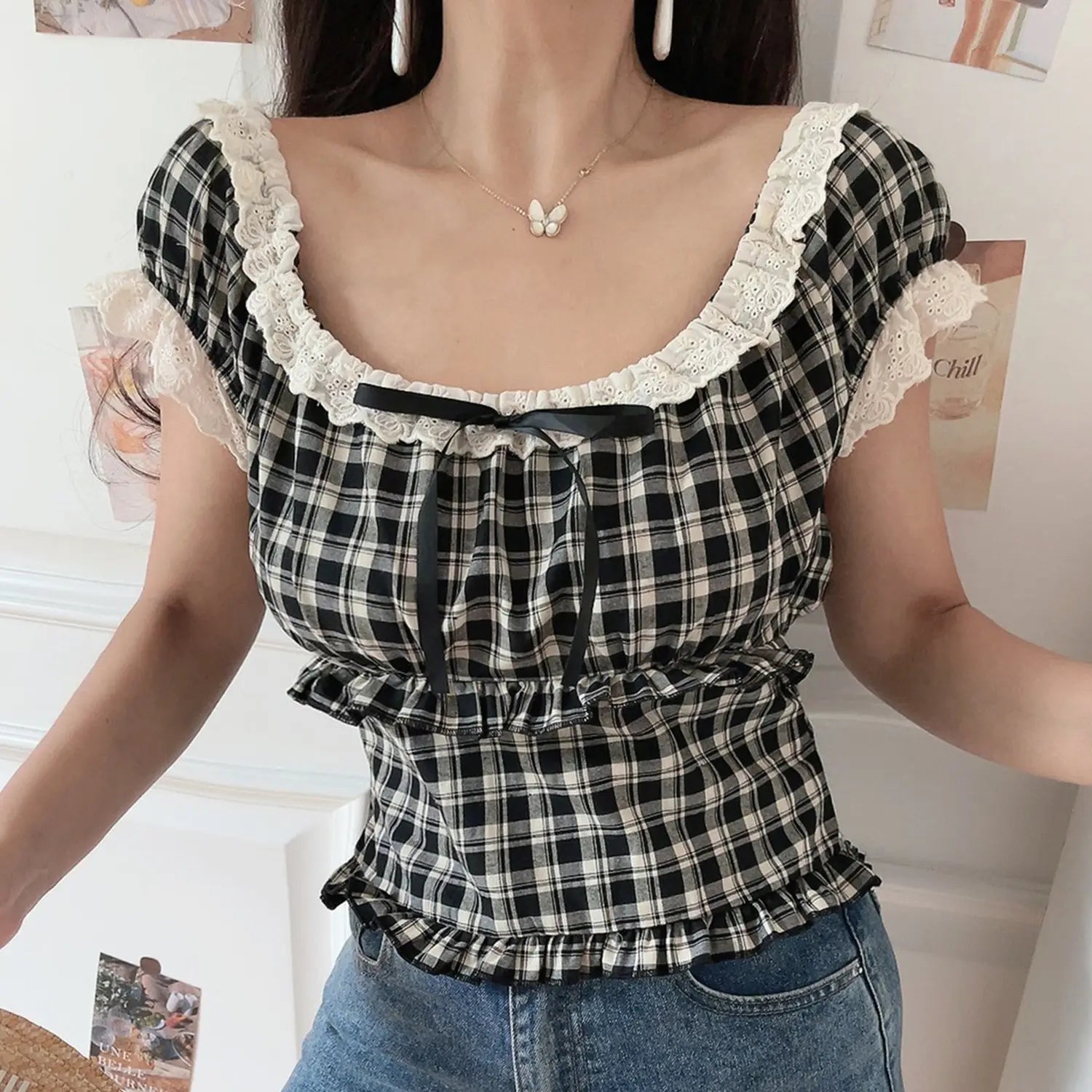 Women black white plaid lace square neck smocked crop top, puff sleeve front ribbon, white wall indoor shot