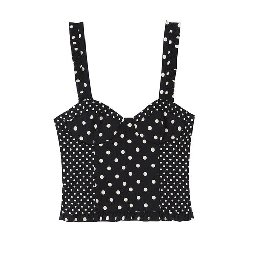  Black and white polka dot bustier crop top with ruffled straps and hem, front view, flat lay on white background.