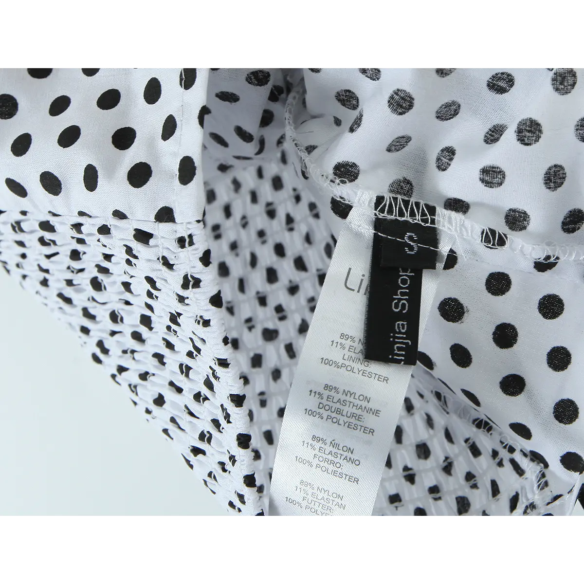 Close-up of the inner label, showing the fabric composition and layered construction.
