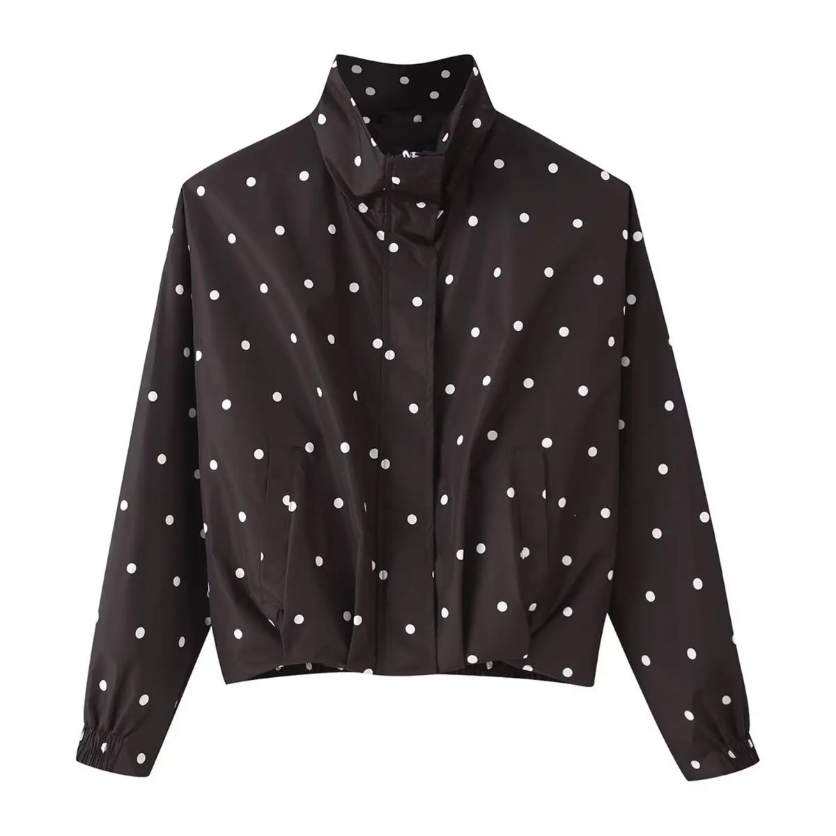 Black cropped windbreaker jacket with white polka dots, stand collar, front placket, side pockets, elastic cuffs, white background, flat lay front view