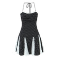 Full front view of the dress, featuring halter ties, lace-trimmed neckline, and lace-paneled skirt.