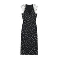 Flat lay front view black midi dress with white polka dots and contrast pleated cap sleeves