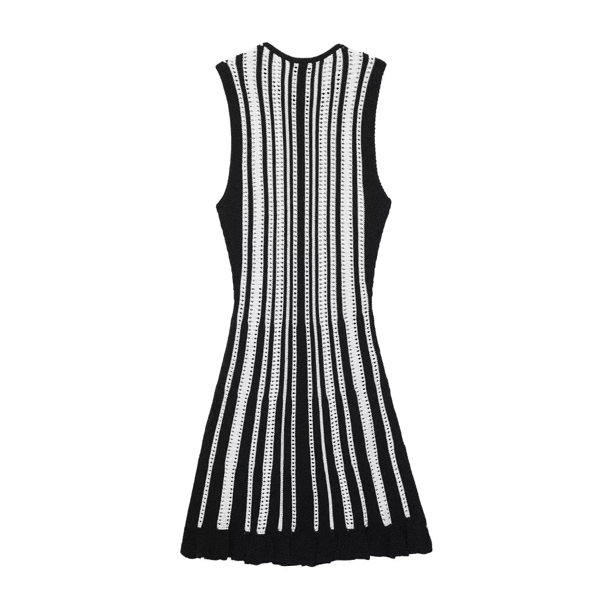 Full back view of a black and white striped knit mini dress, showcasing the vertical openwork stripes and ruffled hem.