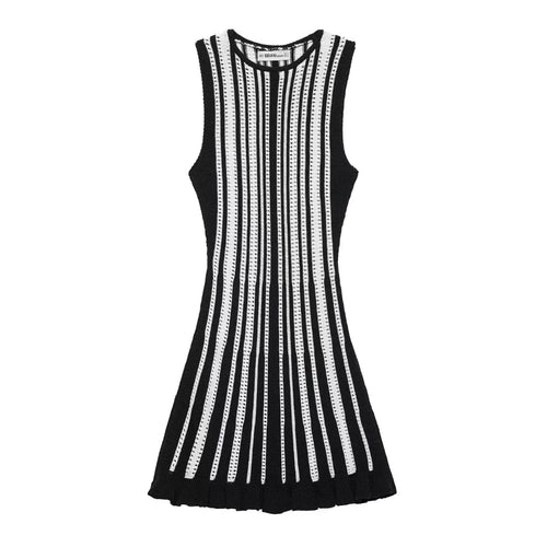 Full front flat view of a black and white striped knit mini dress, displaying the vertical stripes, round neckline, and ruffled hem.