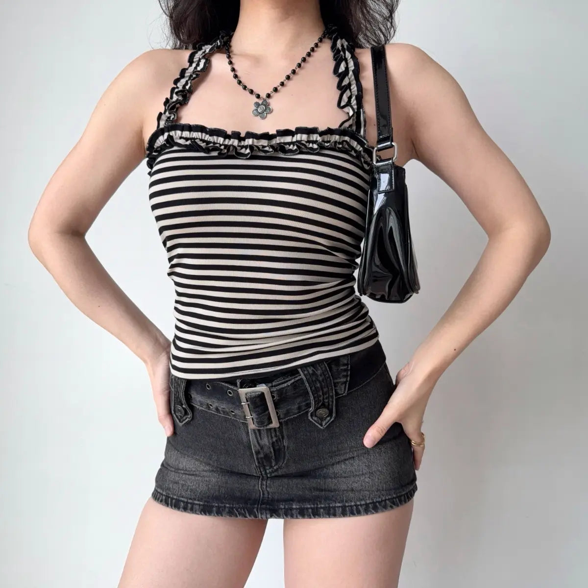  The full look, showcasing the top, skirt, accessories, and styling in a casual pose.
