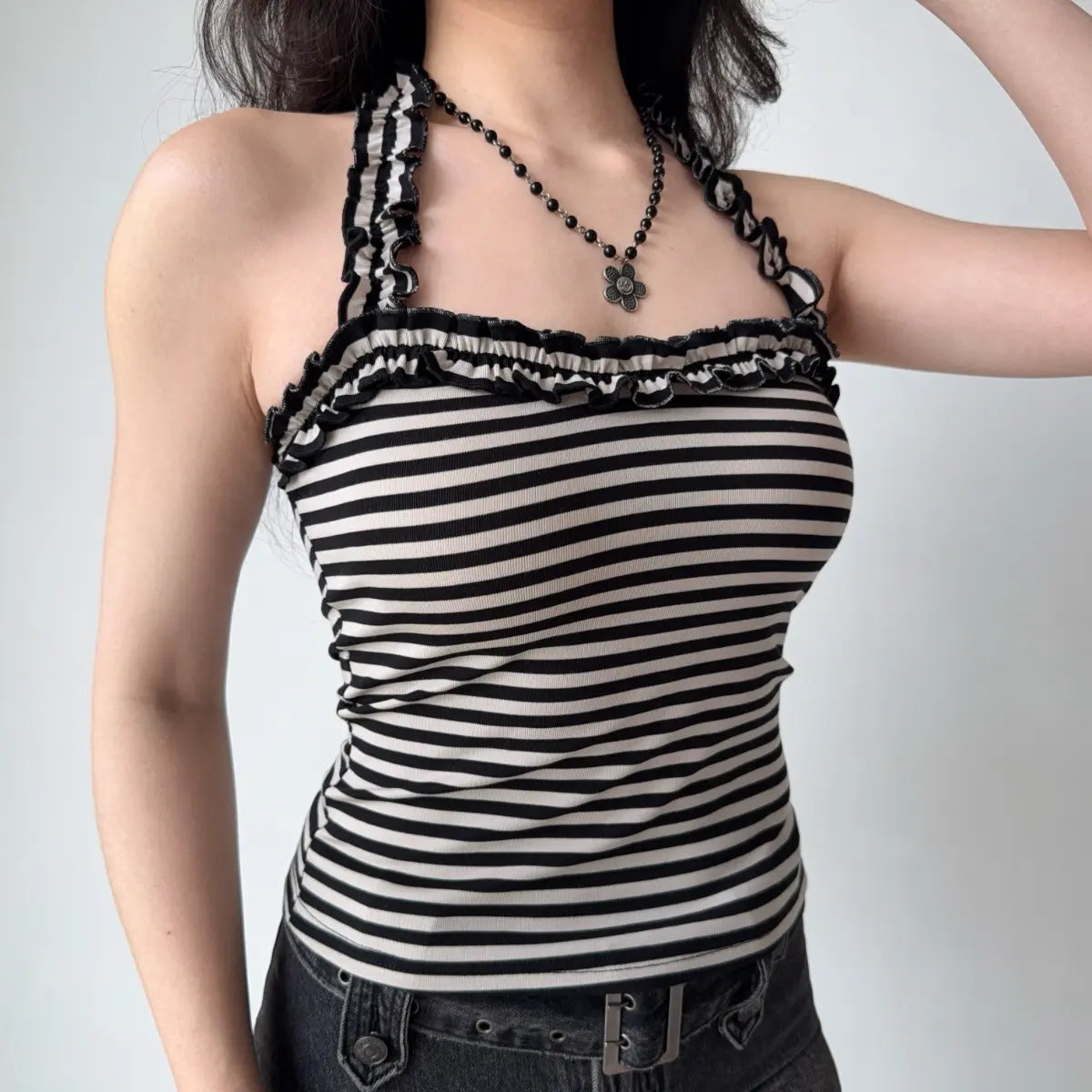 The outfit with the addition of a glossy black shoulder bag.
