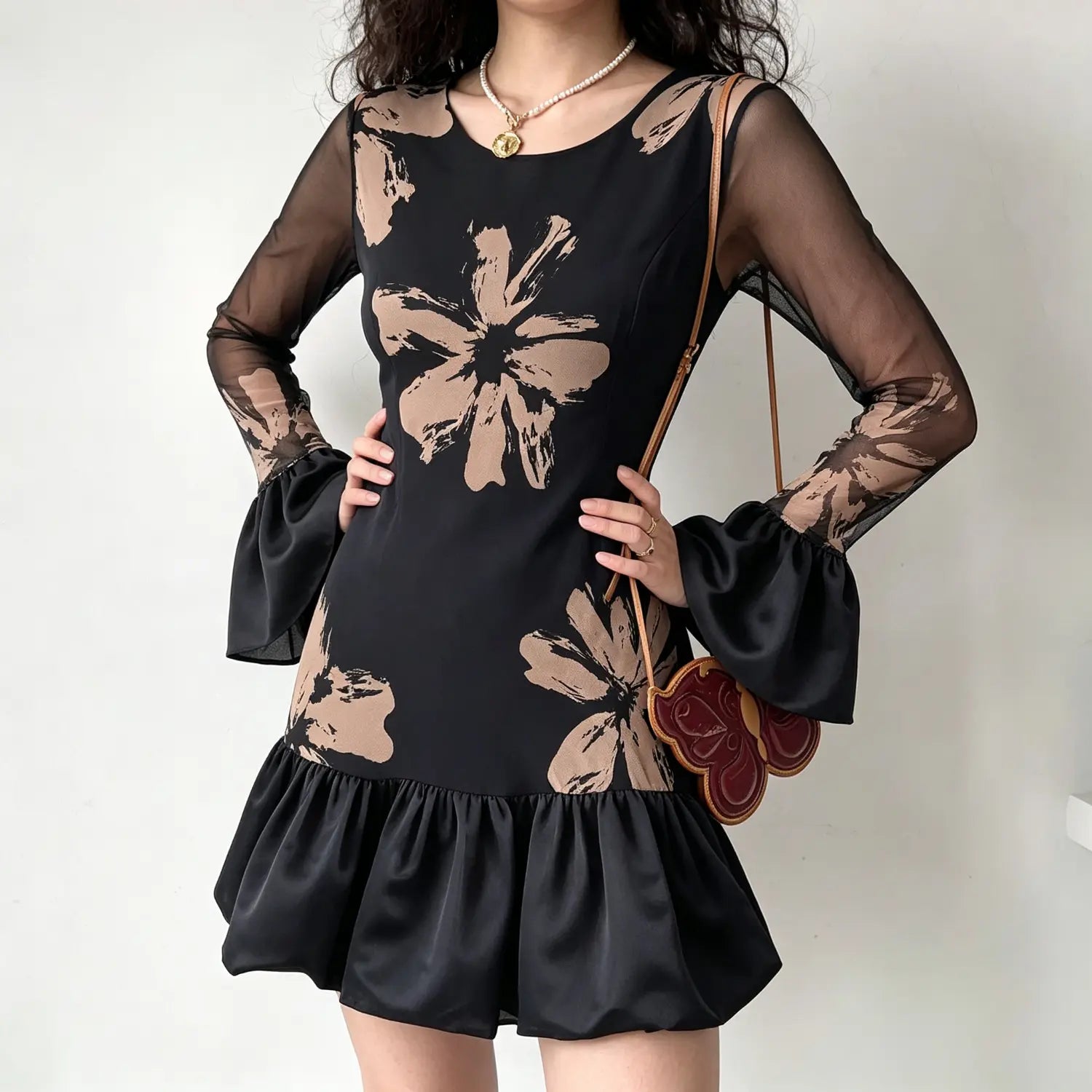 Model wearing black beige abstract floral mesh mini dress,long bell flare sleeve,ruffle hem