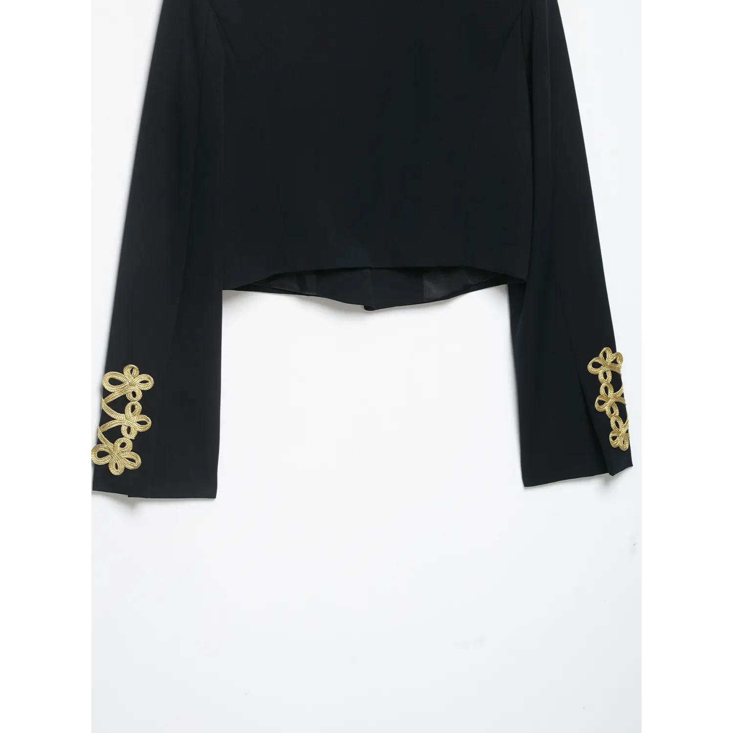Back view showing sleeve cuffs gold braid embroidery on black cropped blazer