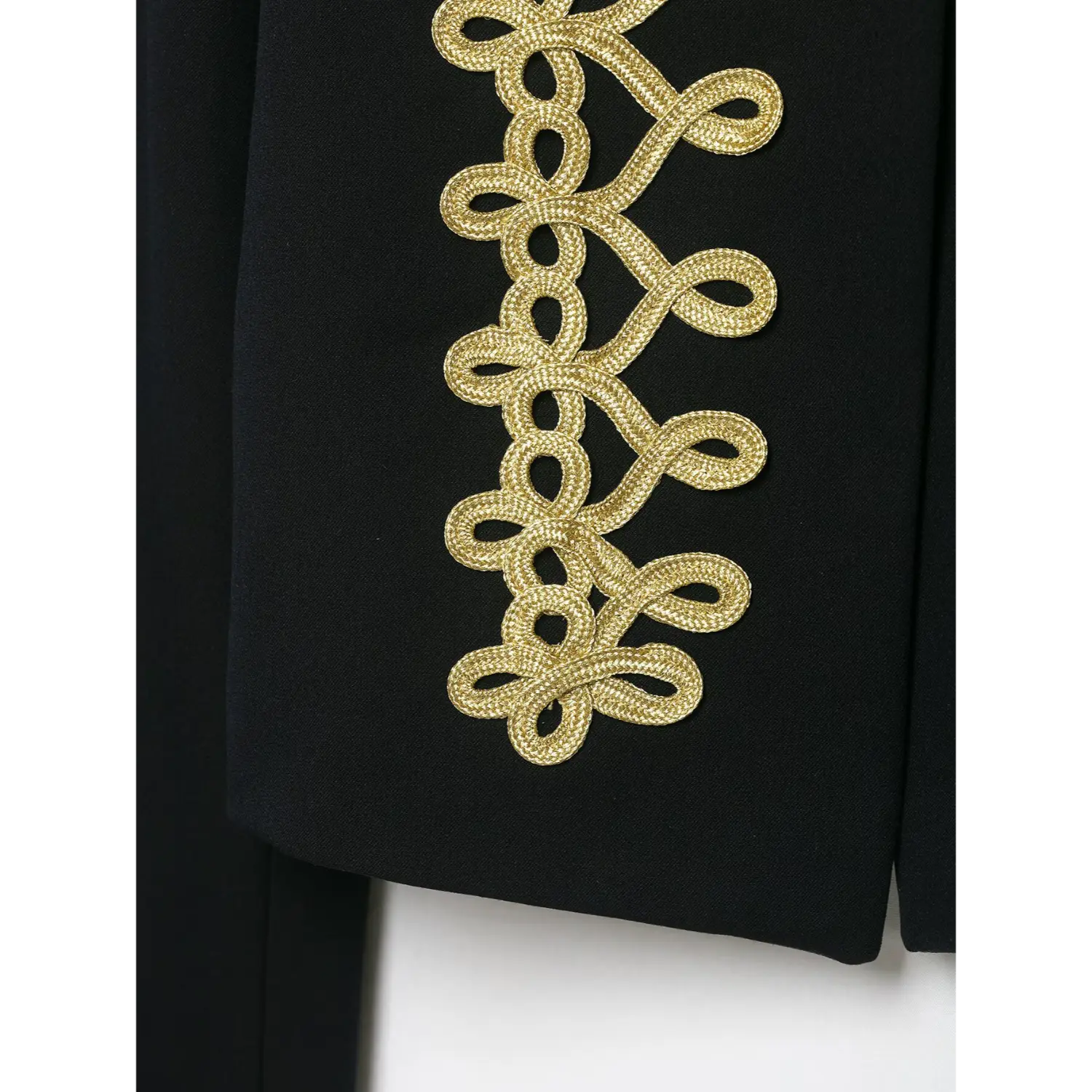 Single panel close‑up gold braid embroidery on black cropped blazer