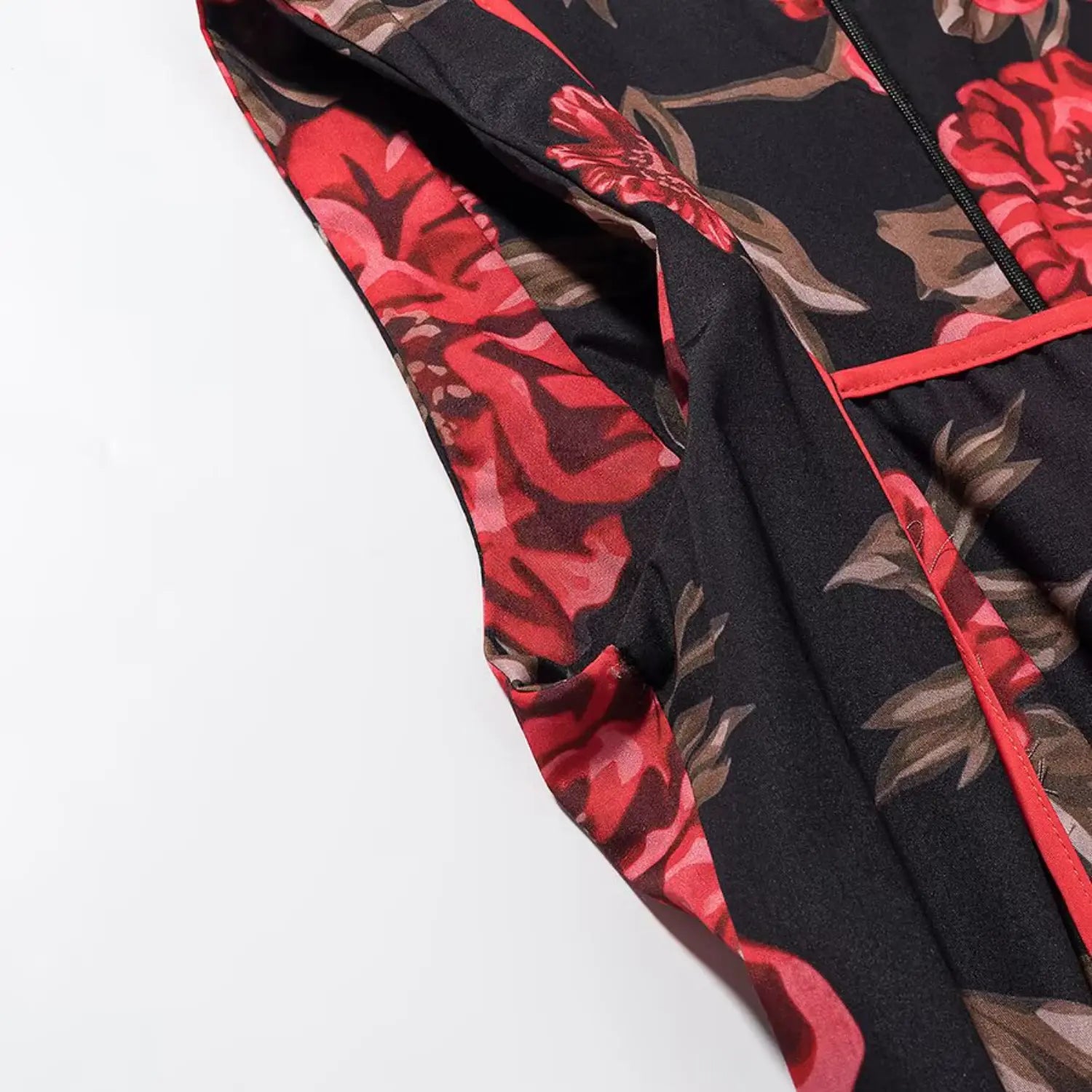 Partial inner view of armhole with red piping trim