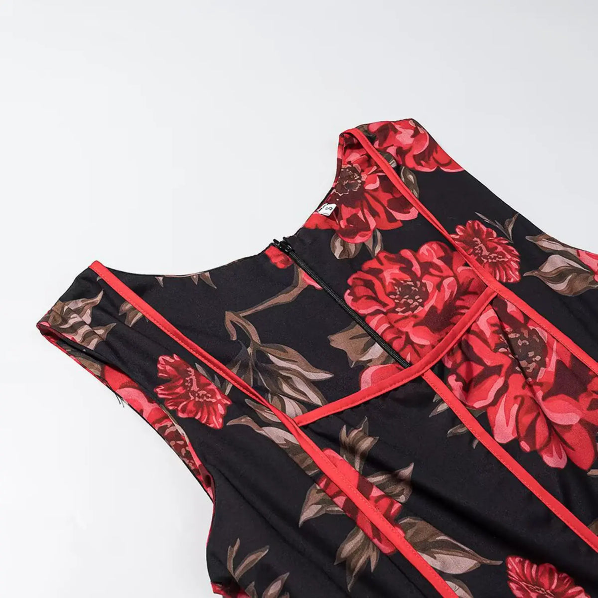 Close‑up of back neck and red piping seam detail