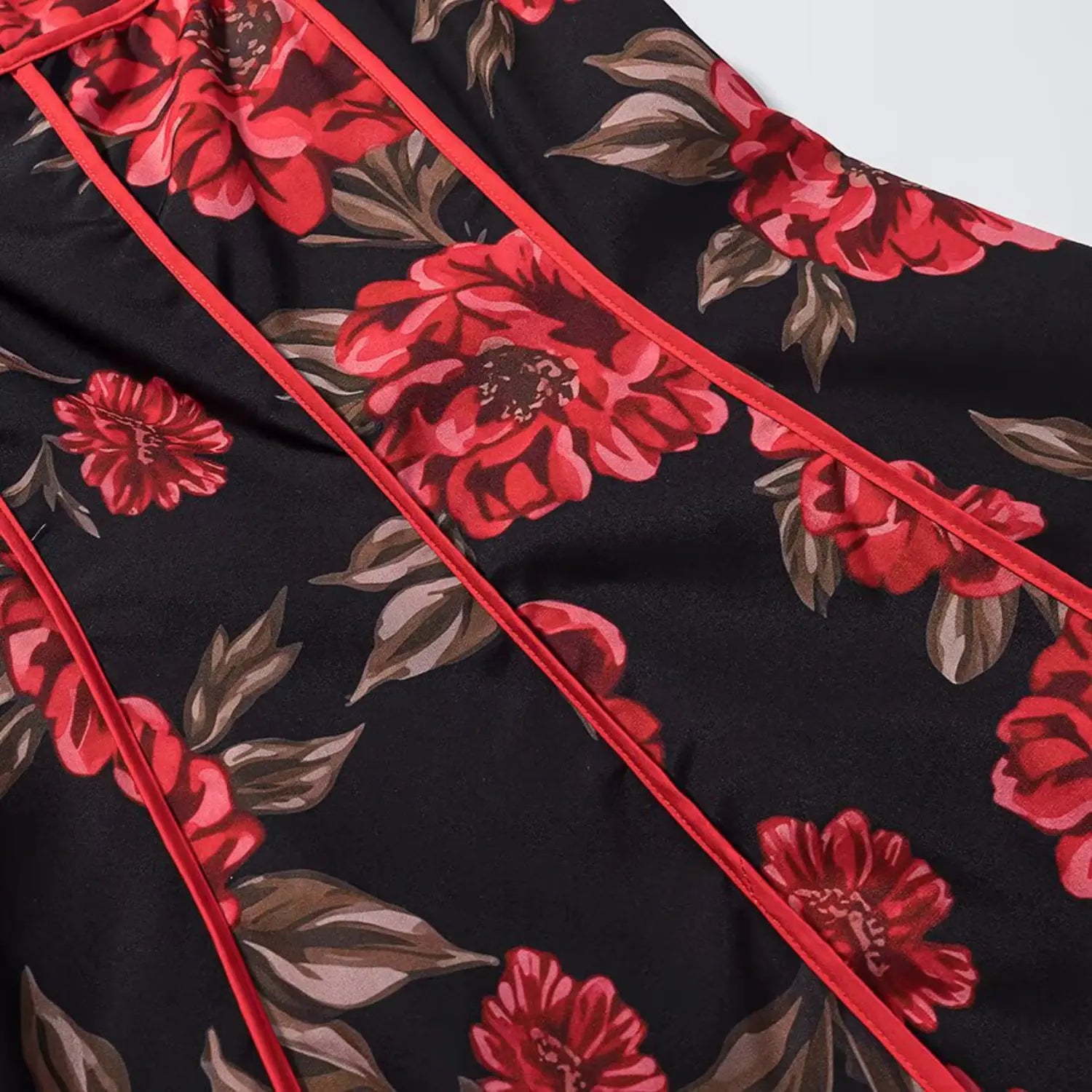 Close‑up of red piping seam at bust and shoulder