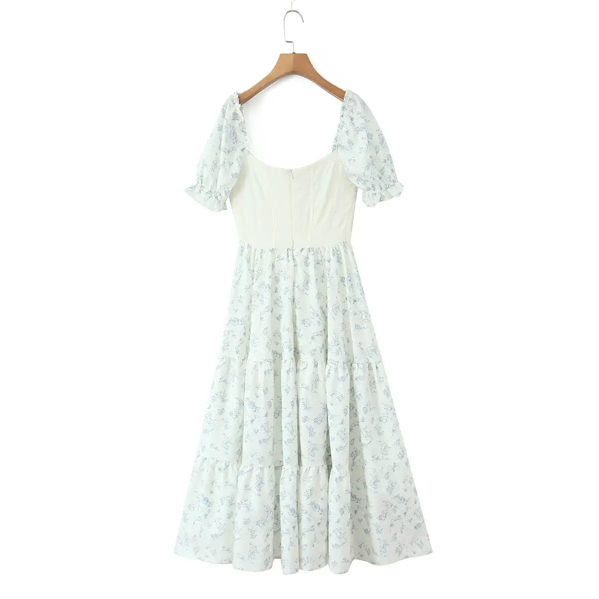Full back view of the dress, featuring the fitted textured bodice and tiered floral print skirt.