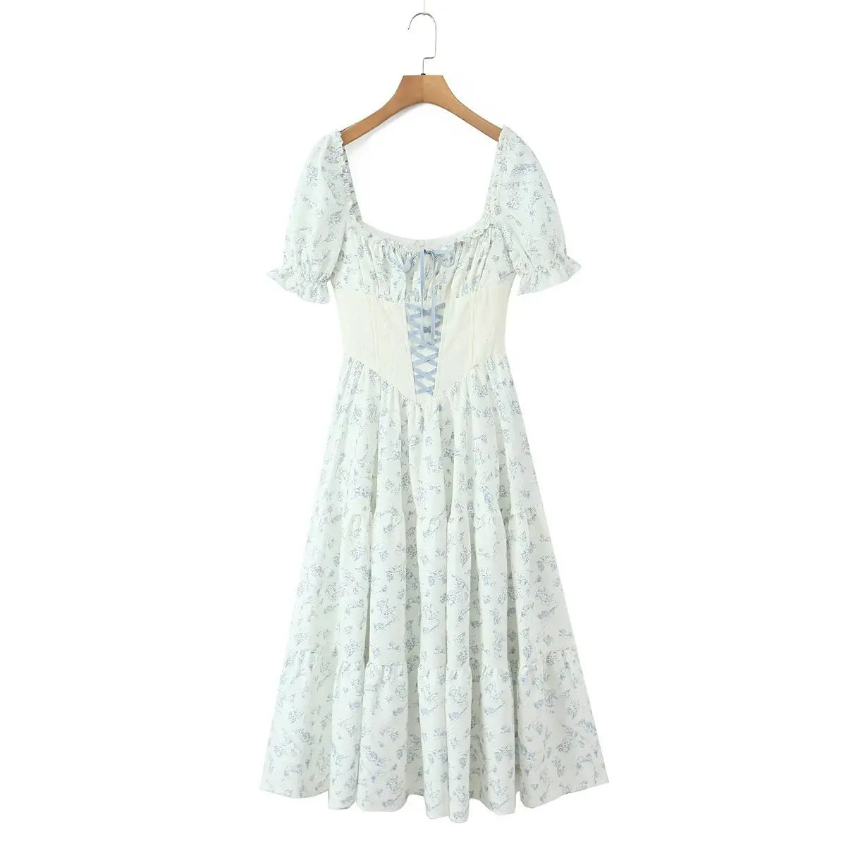 Hanging front view of the dress, showing the square neckline, puff sleeves, and full tiered skirt.