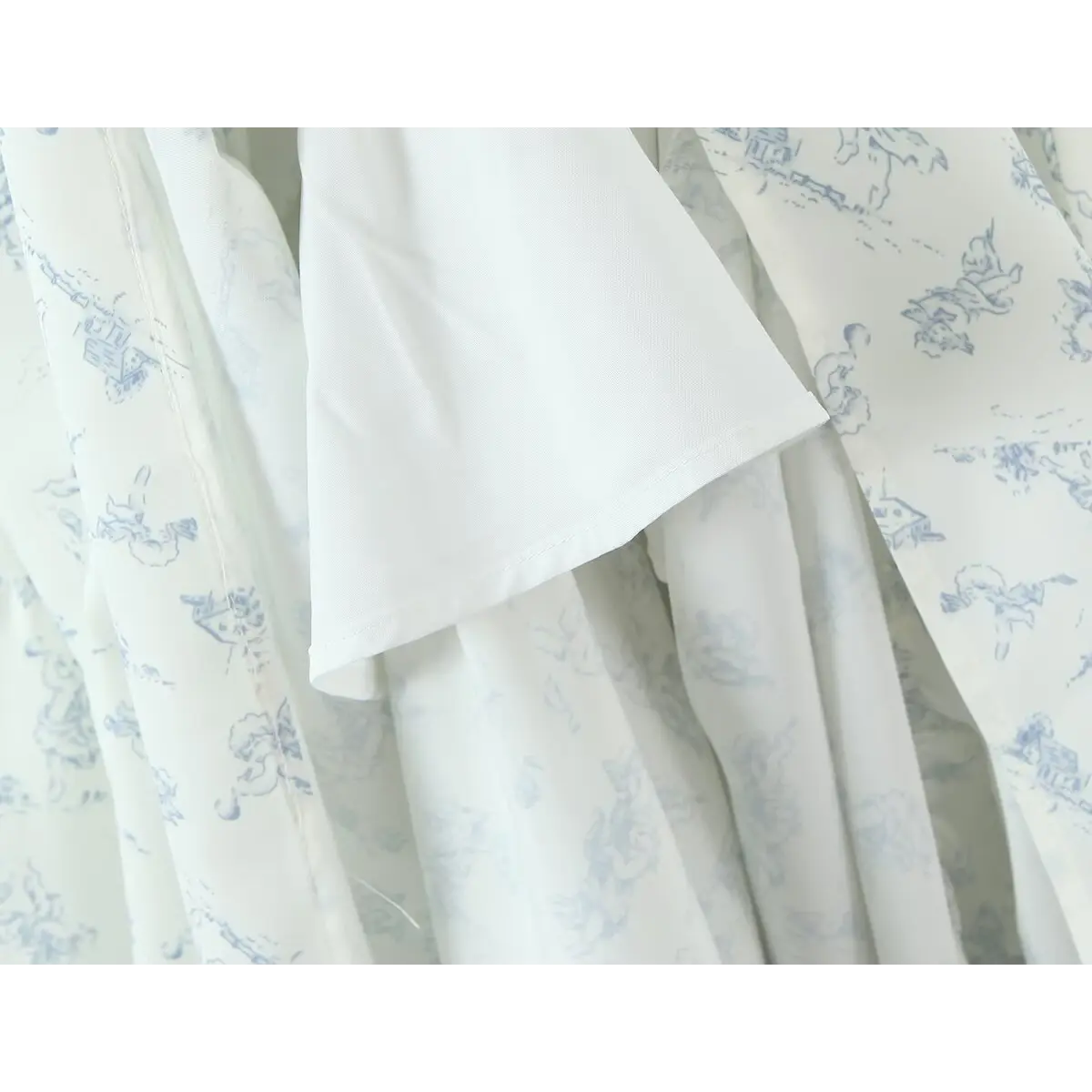  Close-up of the skirt lining, showcasing the smooth inner fabric and finished hem.