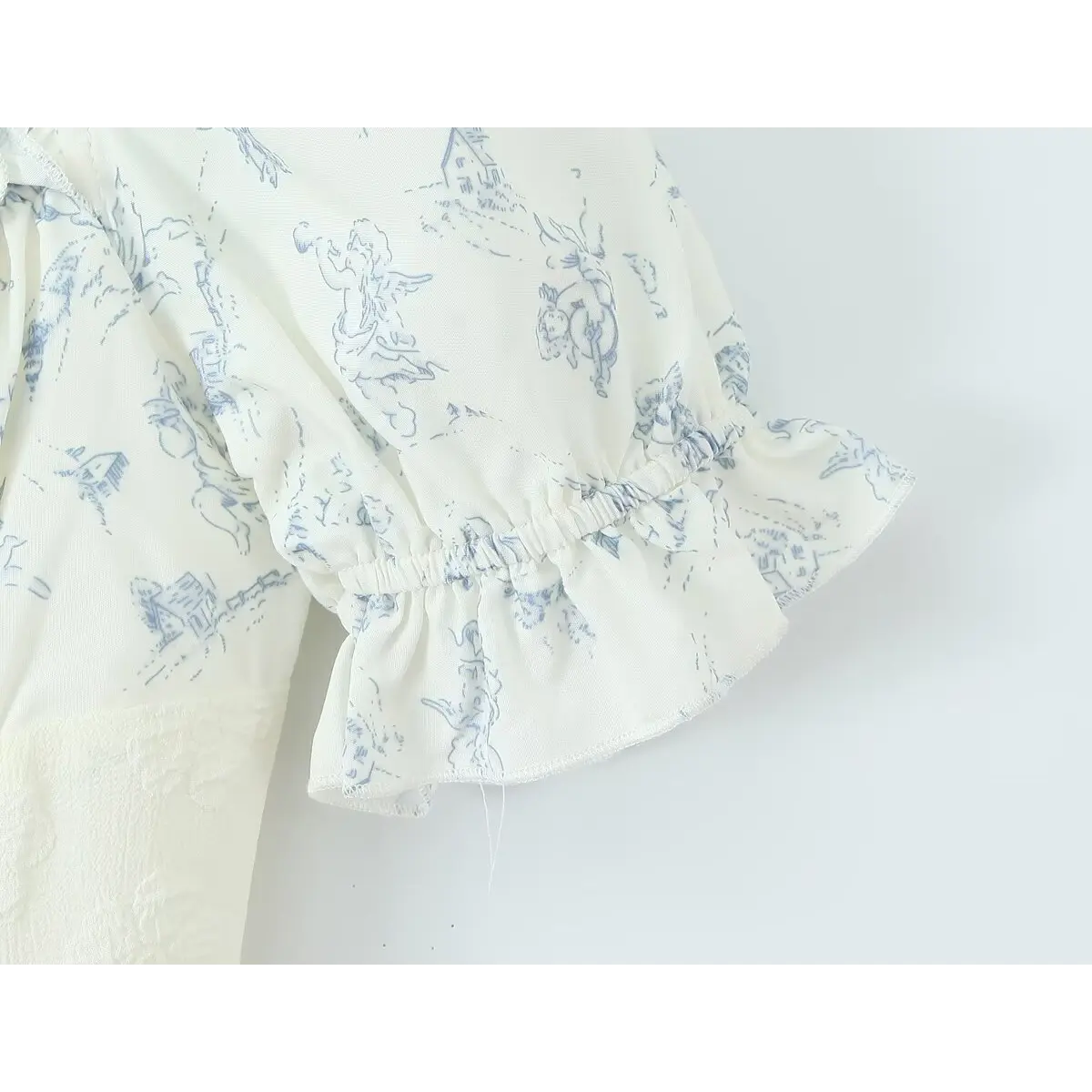 Close-up of the elasticated puff sleeve cuff with ruffled edge and matching print.