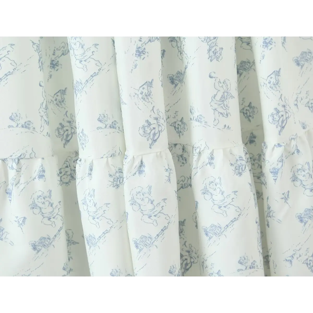 Close-up of the tiered skirt construction, showing the gathered layers and print pattern.