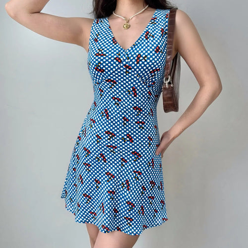 Blue gingham cherry mini dress model daily wearing shot, V-neck flatter collarbone drawstring shape waist A-line swing hem hide hip summer vacation sweet outfit display