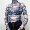 Studio model torso shot blue sheer mesh turtleneck long sleeve top with vintage angel sky print
