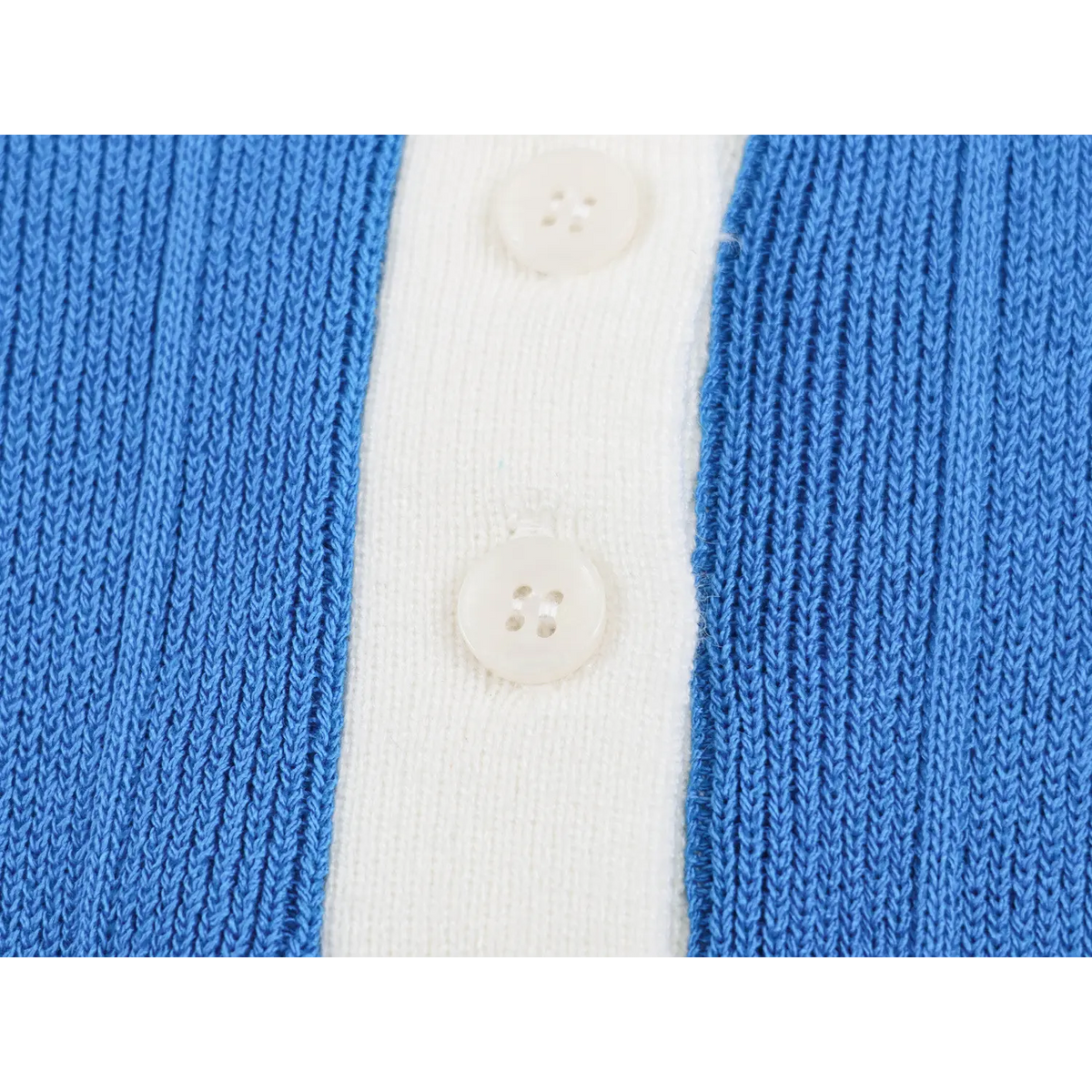 Close-up of white four-hole buttons