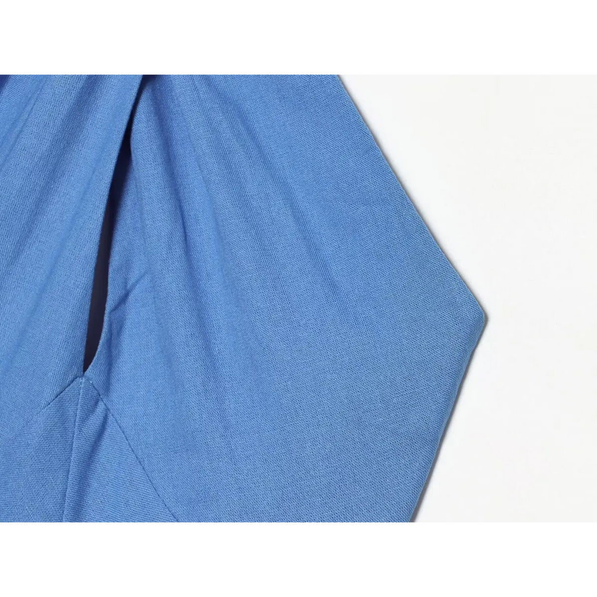 Close-up of blue armhole and linen fabric texture