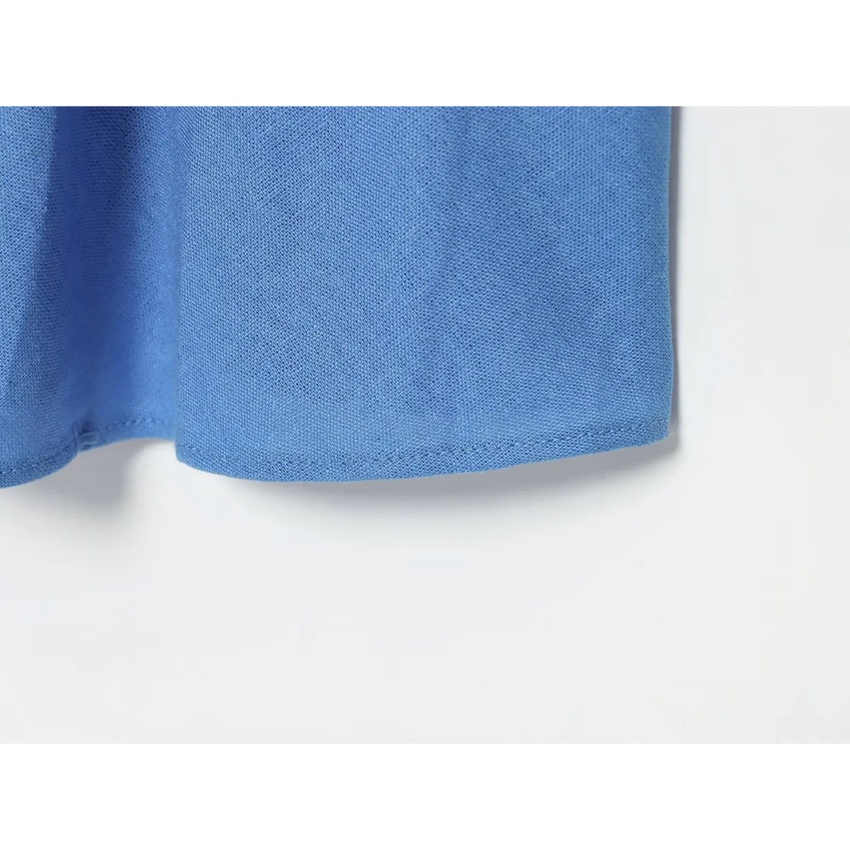 Close-up of blue maxi skirt hem stitching