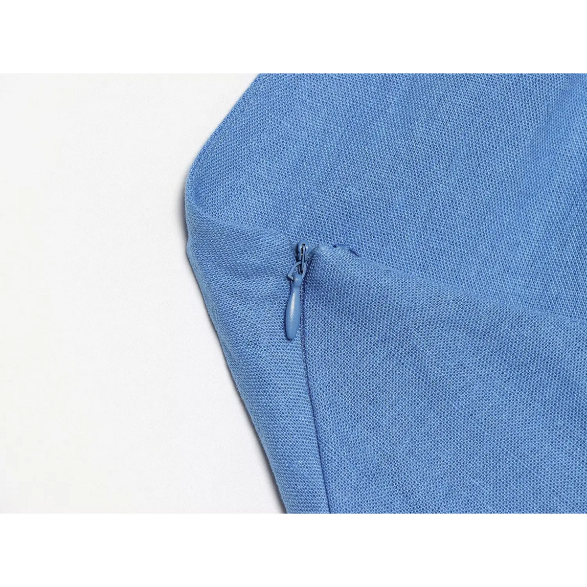Close-up of blue side zip