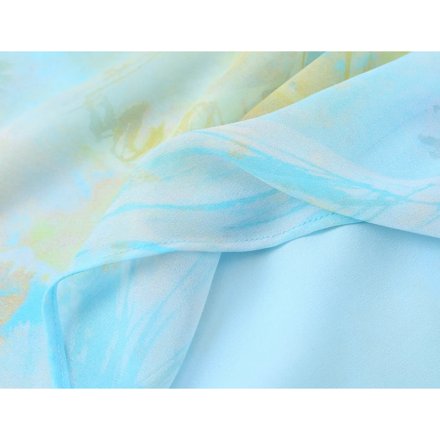 Close-up of stitching seam and inner lining of blue green watercolor floral slip dress