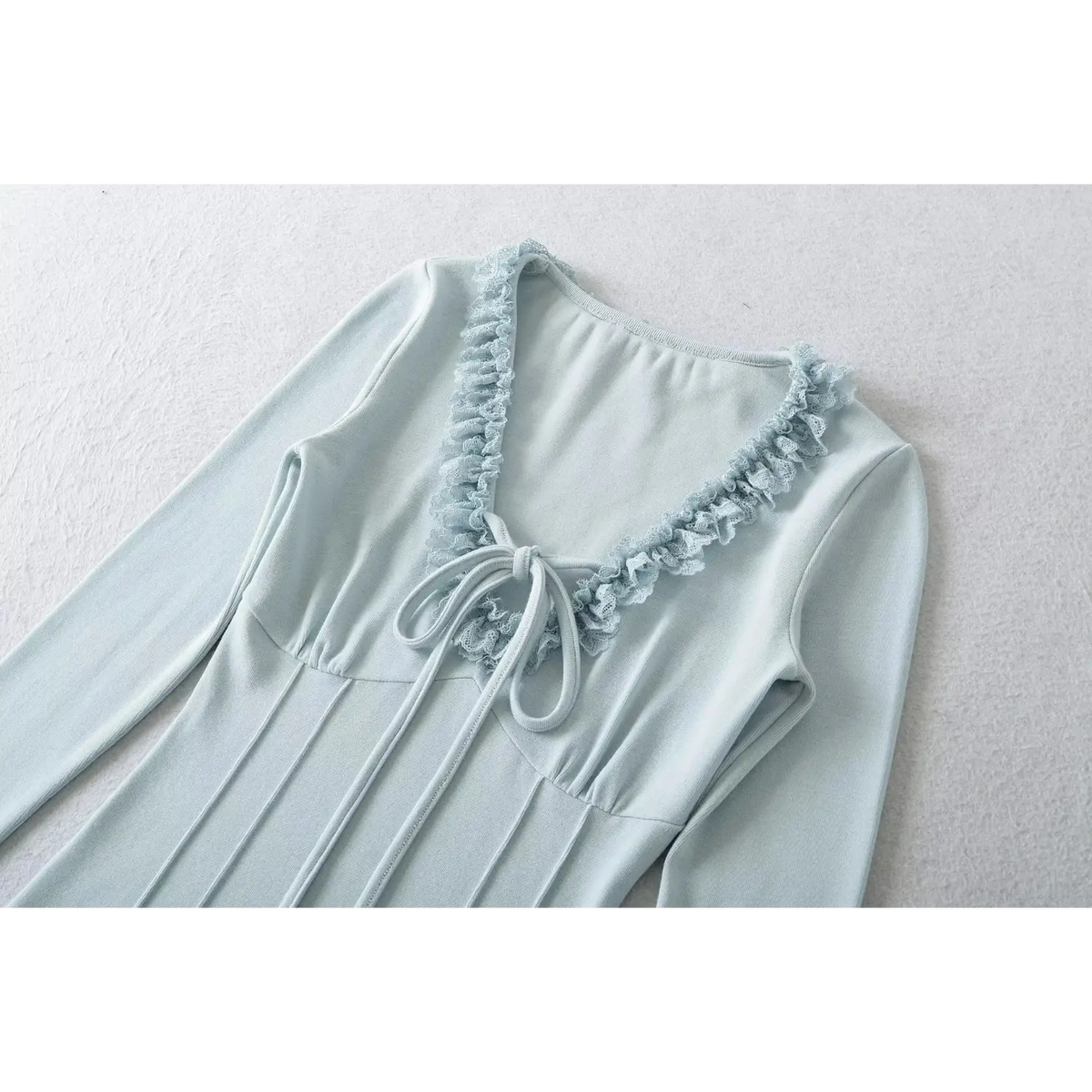 Blue women long sleeve top, v neck with lace ruffle trim and front tie knot, fitted bust seam design