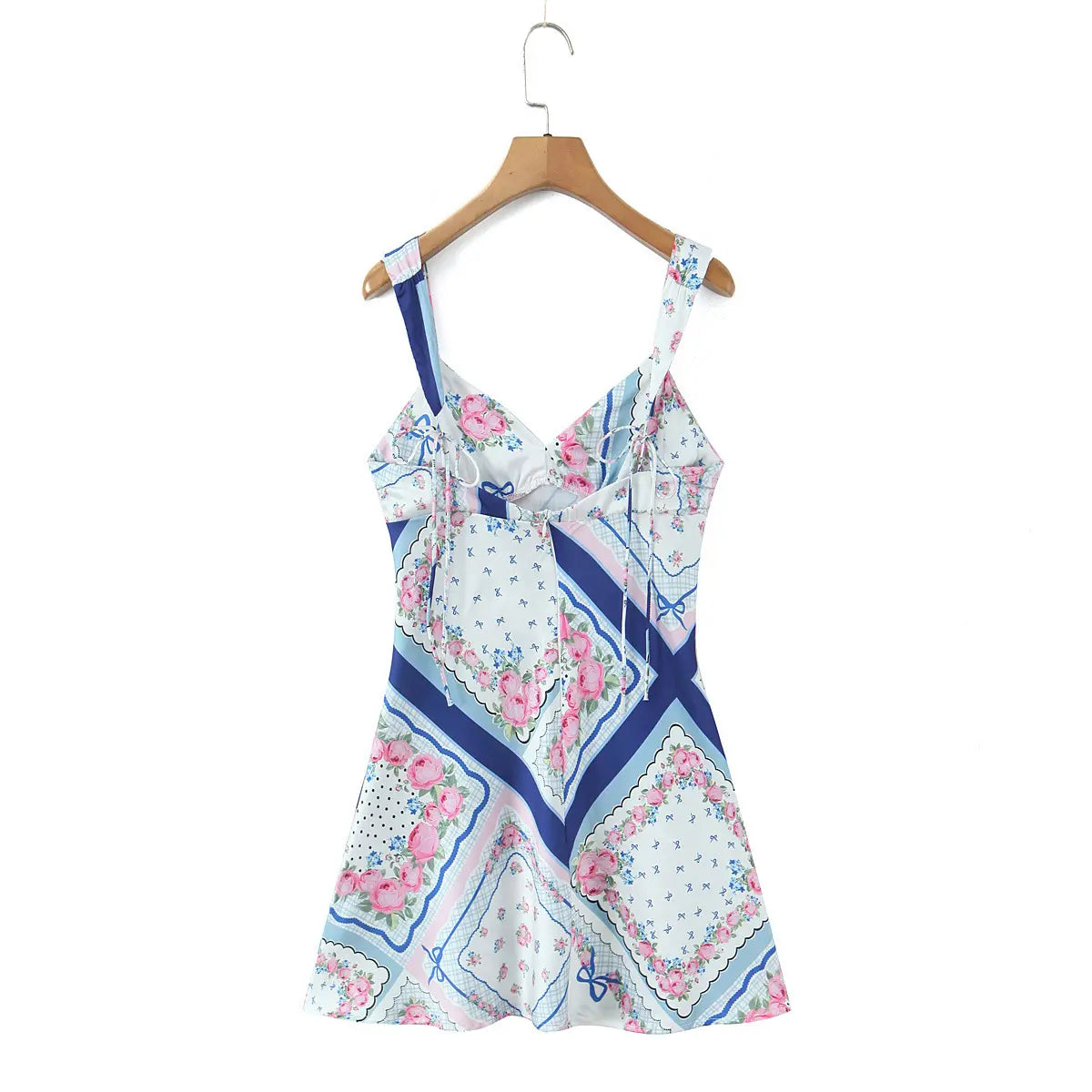 Back view of the blue and pink floral scarf print dress on a wooden hanger, showing silhouette and print.