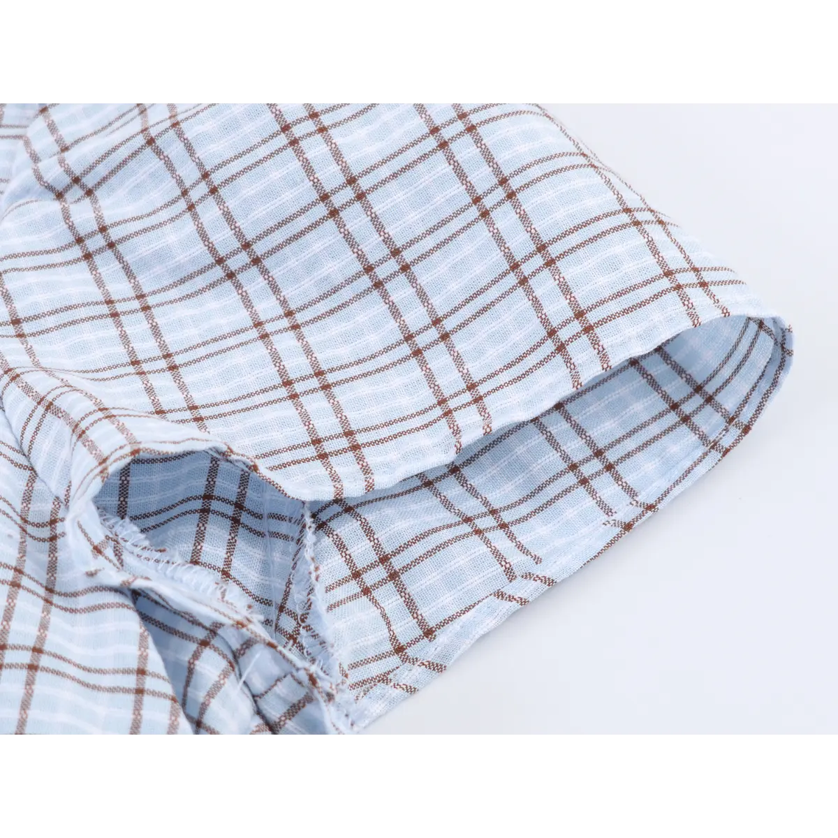 Close-up of the dress's tiered skirt, showing the fabric layers and seam finishing.