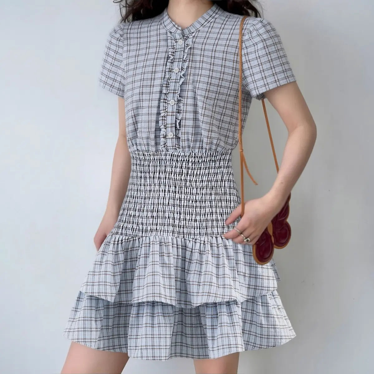 The dress styled on a model, highlighting its fit and classic, preppy silhouette.