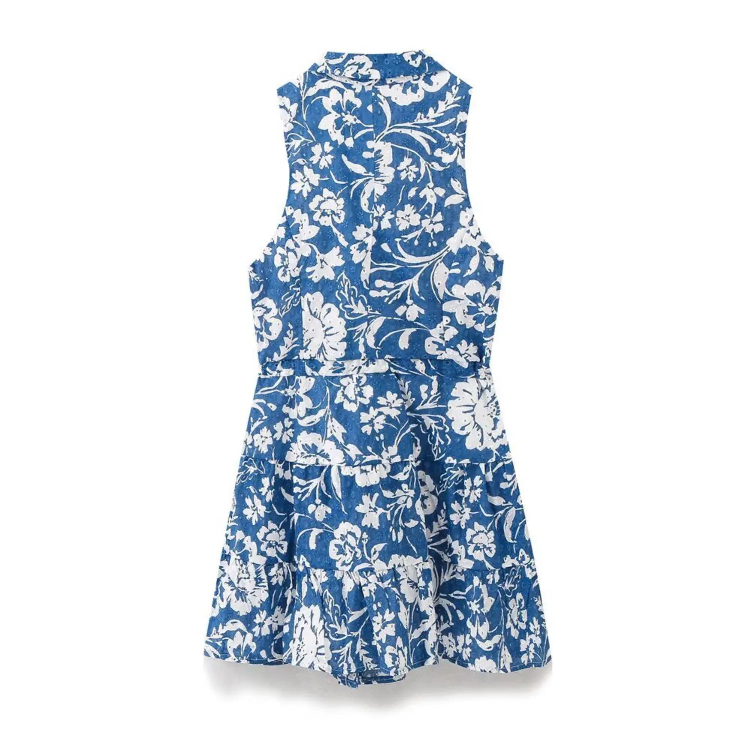  Back view of a blue and white floral print sleeveless dress, showing the eyelet fabric and tiered skirt