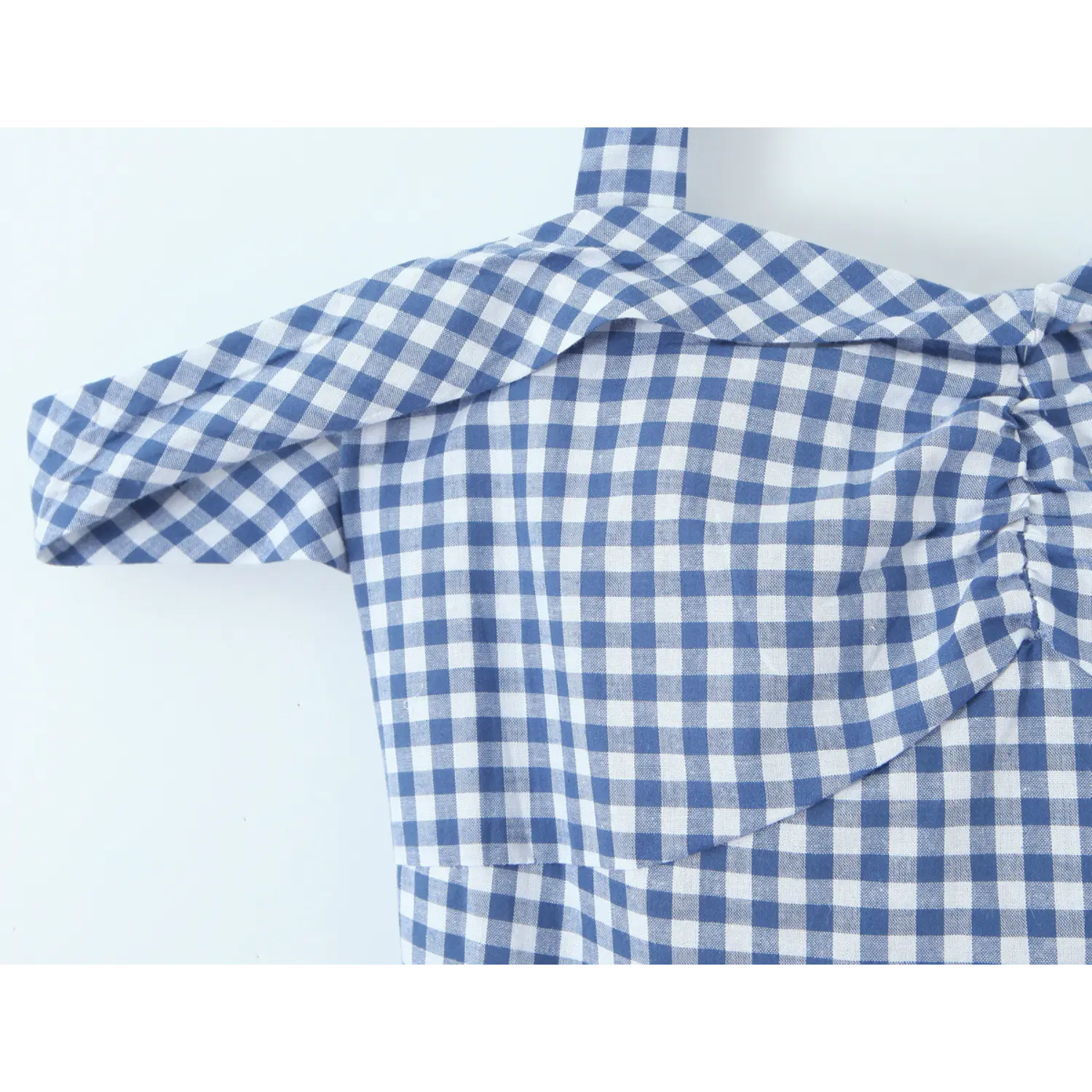 Uniform blue white gingham woven fabric macro flat close-up, breathable plain weave neat symmetrical check print lightweight spring summer cottage cloth shot