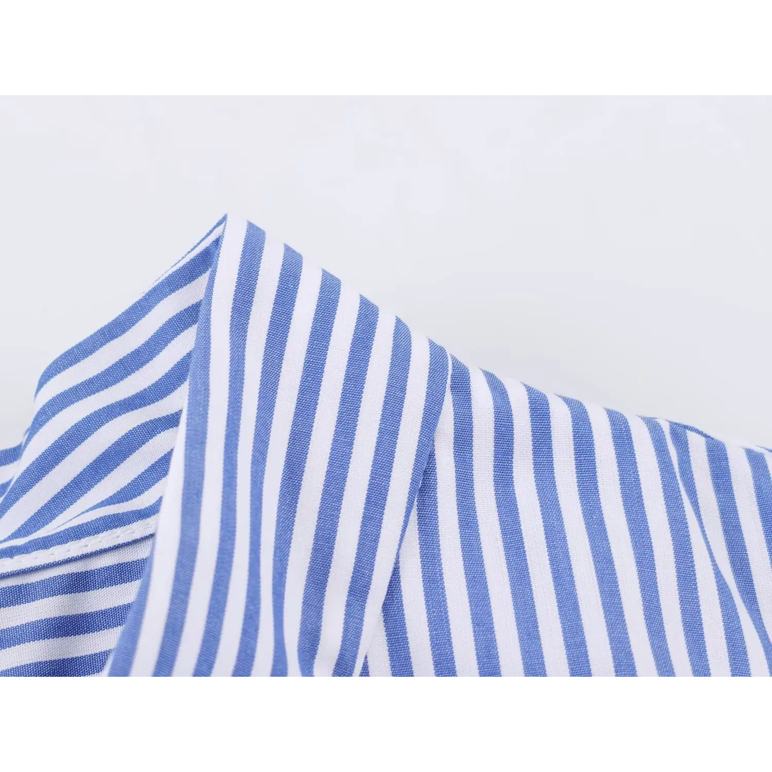 Extreme closeup lightweight vertical stripe cotton blend fabric
