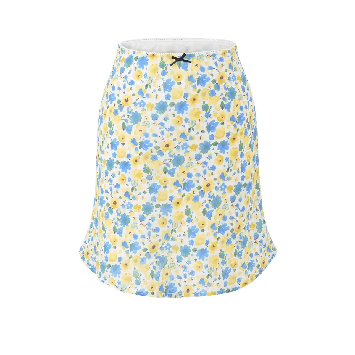 Angled view of a woman wearing a blue and yellow floral chiffon mini skirt, paired with a white cropped knit top, showing the print and flowy hem.