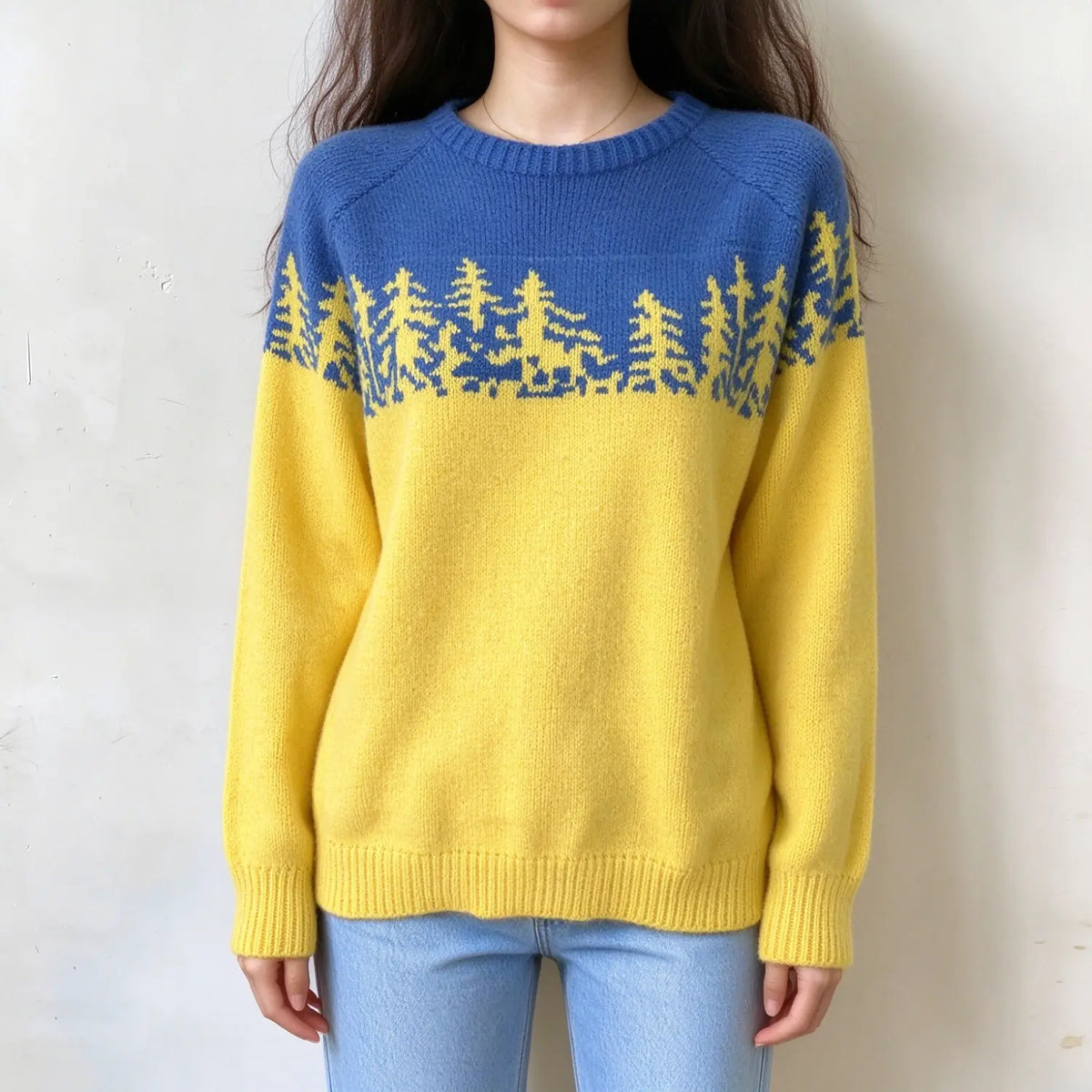 Female model wears blue yellow color block fairisle pullover, pine tree jacquard on yoke, crew neck relaxed fit knit sweater, front shot