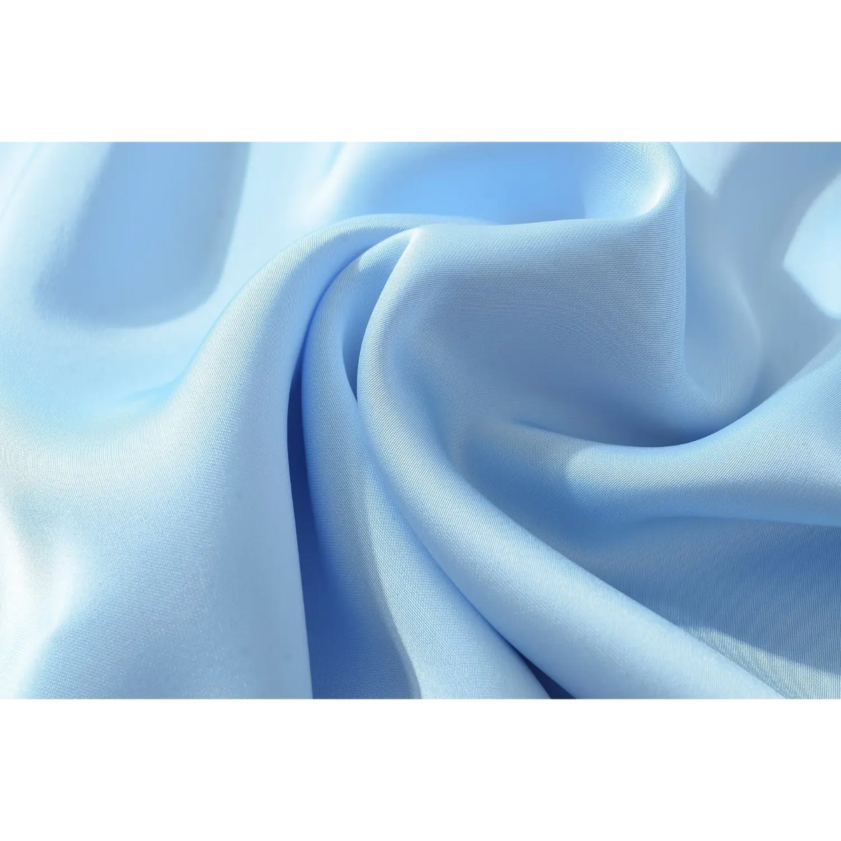 Macro close‑up of smooth glossy blue satin fabric texture