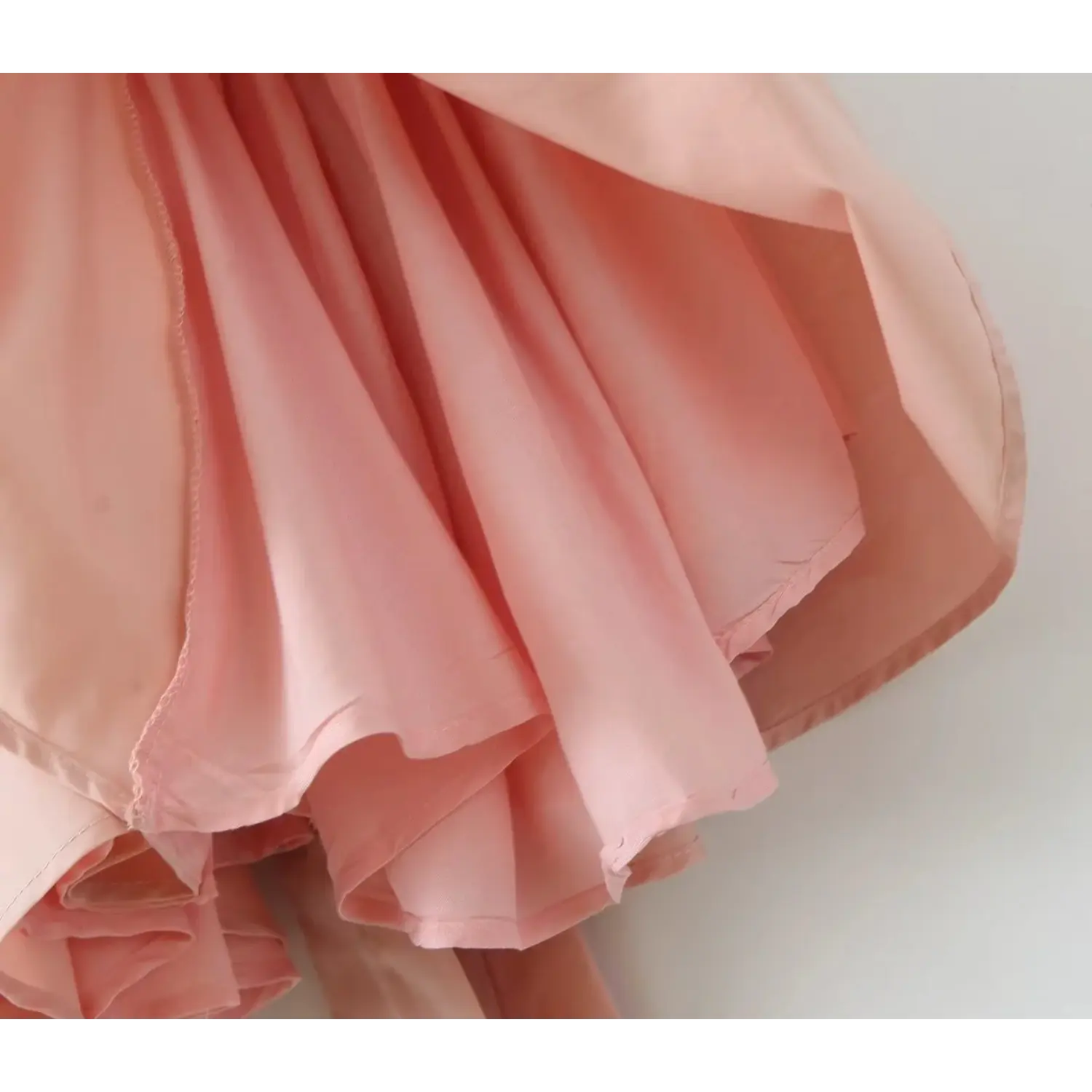 Inside partial shot showing full inner skirt lining, soft blush pink fabric, neat seam workmanship