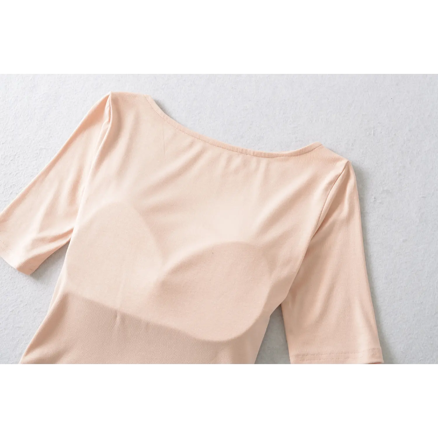 Blush pink back fabric stretch texture close up, soft lightweight jersey fitted midi sleeve cropped t shirt