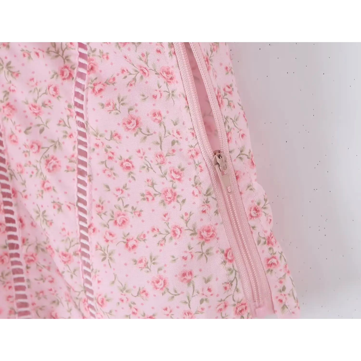 Macro shot side invisible zipper construction, floral print matching tape