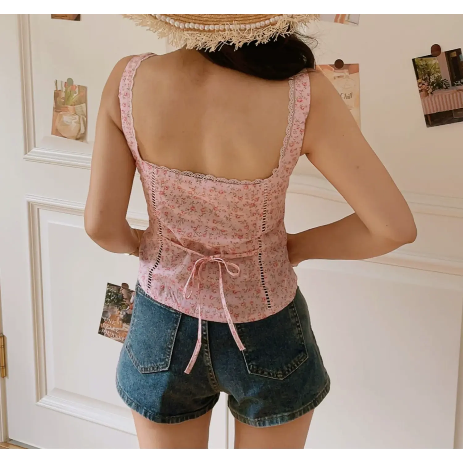 Back lifestyle shot blush pink ditsy floral corset cami top, square back, rear self tie ribbon, eyelet vertical cutout detail, white lace trim strap