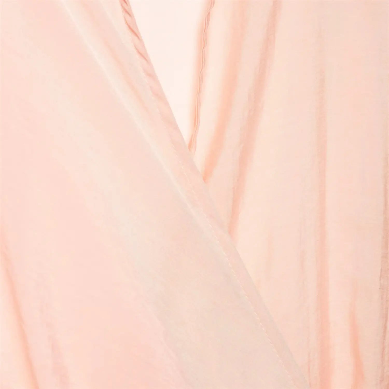 Macro close-up of light pink satin fabric, slight sheer translucent texture, natural soft wrinkled drape, fine twill satin weave detail