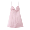  Full flat front view of a blush pink satin mini dress, displaying the structured bust, central knot, and pleated A-line skirt.