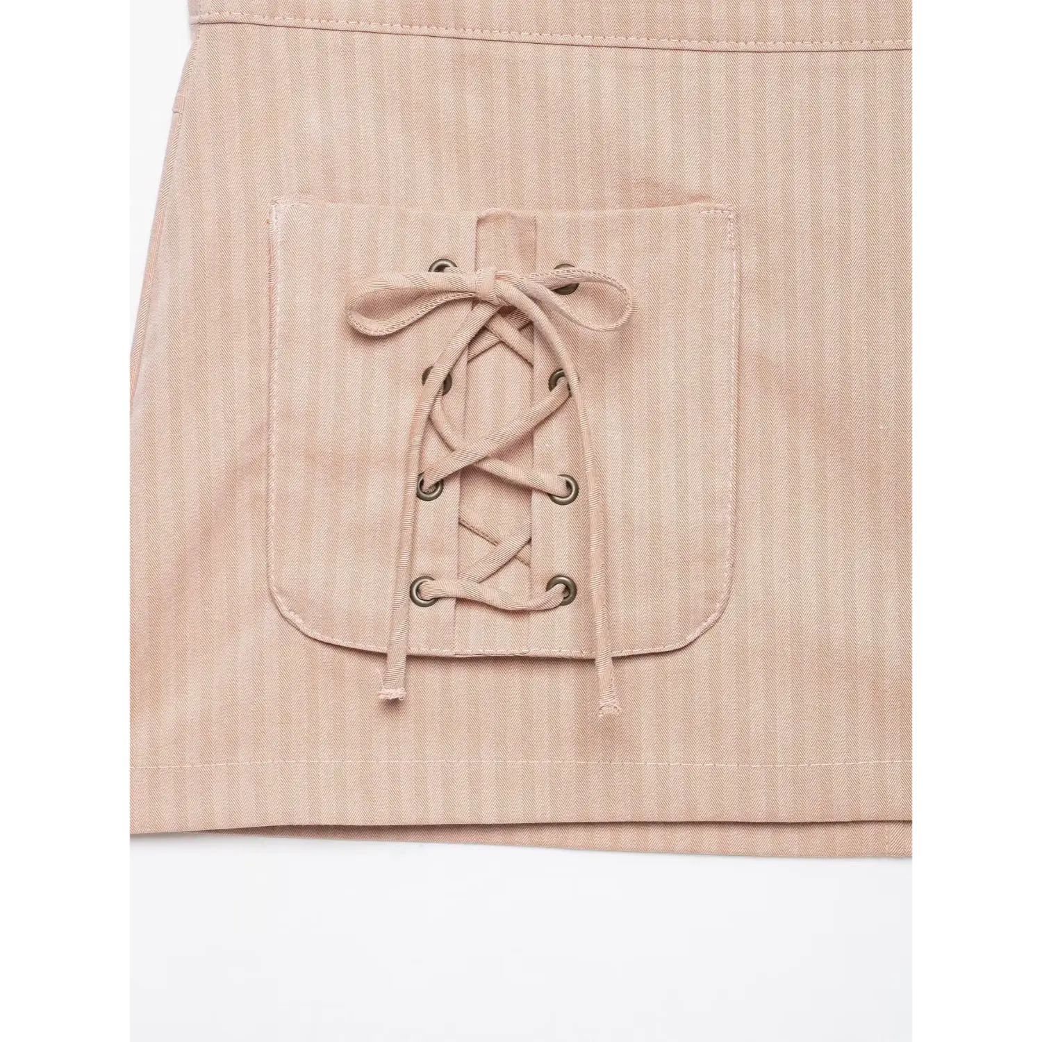 Extreme close‑up single pocket crisscross lace‑up eyelet detail blush pink striped mini skirt