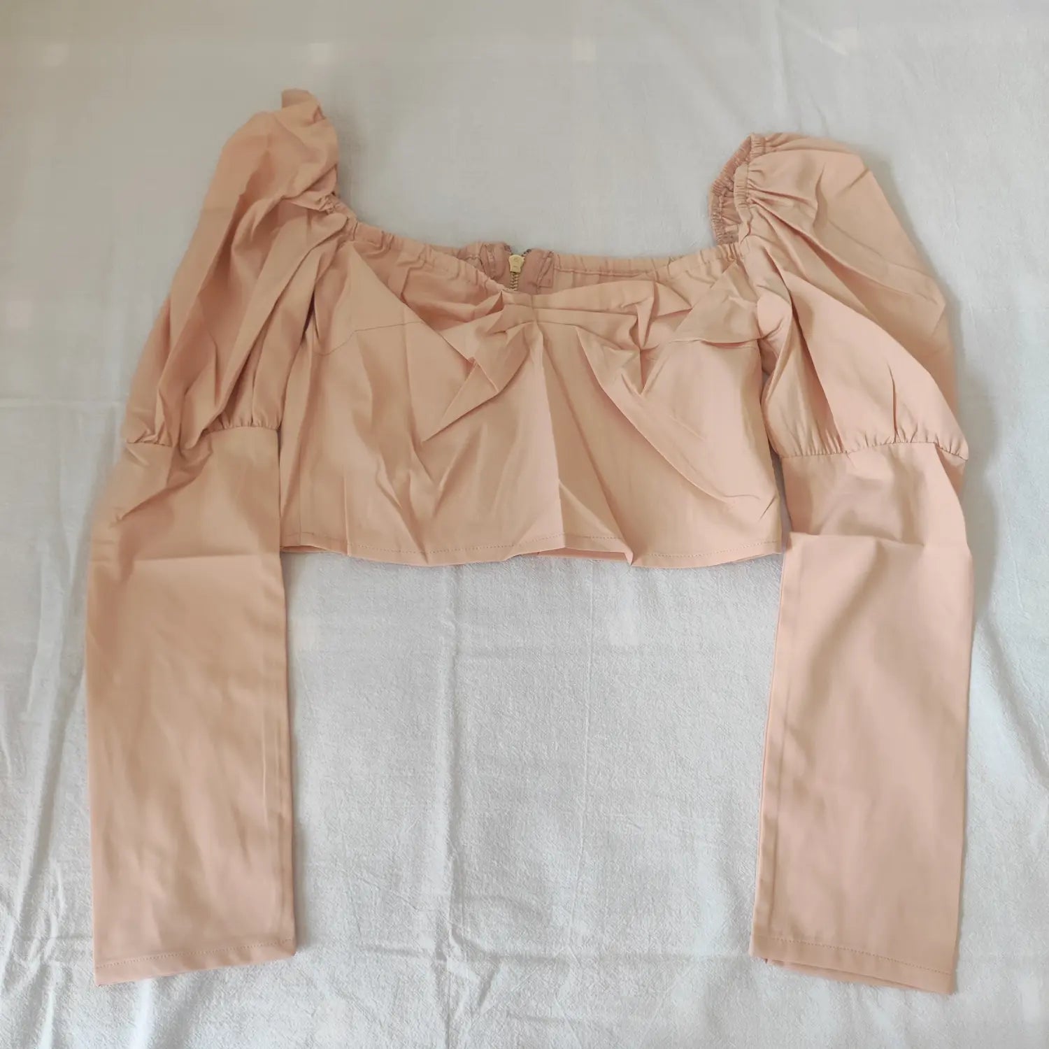 front-flatlay-view | Flat lay front blush pink cropped blouse, ruched bust, puff long sleeves