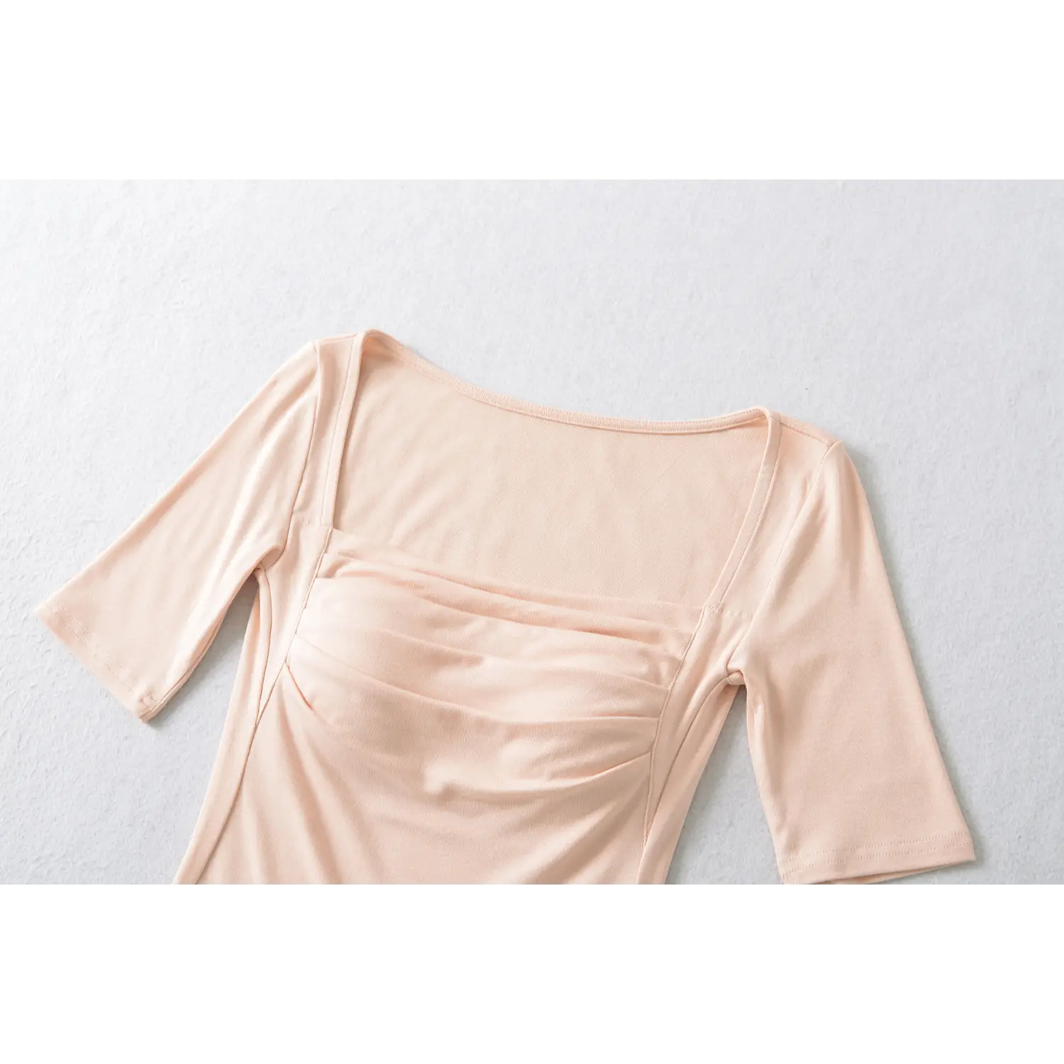 Blush pink square neck ruched bust close up detail shot, wide shoulder strap soft knit fabric fitted crop tee